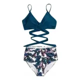 Conjunto de bikini de dos piezas de la marca Uniteduy, compuesto por un crop top amarillo liso con diseño cruzado y tirantes finos, y una bombacha de tiro alto con estampado floral y de hojas en tonos amarillos, verdes y blancos.