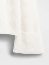 Buzo de tejido de punto con cuello redondo, mangas largas y diseño holgado.