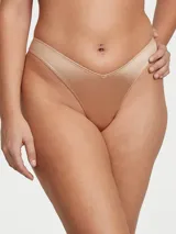 Panty tipo tanga tiro alto color praline, confeccionada en tela suave con acabado satinado y diseño cavado.