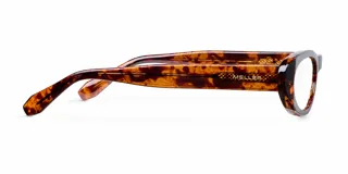 Lentes Blueblocker modelo Malaika Tigris con montura ovalada de carey, diseño plano que sugiere estilo ojo de gato. Cuentan con protección contra luz azul y rayos UV400.