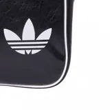 Bandolera Adidas modelo Airliner OG, color negro con detalles en blanco. Presenta un diseño retro con el logo clásico de la marca estampado en el frente, cierre principal y bolsillo frontal con cremallera.