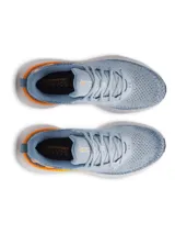 Championes de running Under Armour Infinite, con parte superior de tejido de punto transpirable en tonos azulados y degradado, amortiguación reactiva UA HOVR y suela de goma resistente.