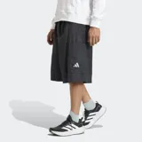 Short Adidas de corte holgado, confeccionado en tejido liso de poliamida. Presenta cintura con cordón de ajuste, bolsillos laterales con cierre y logo reflectante en la pierna.
