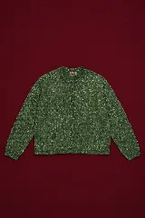 Cardigan de tejido de punto en color verde con destellos de lurex, cuello redondo y cierre frontal con botones al tono.