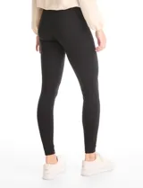 Legging de tiro alto confeccionada en algodón elástico con cintura ancha modeladora. Presenta un calce ajustado y tejido opaco de tacto natural.