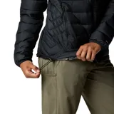 Chaqueta acolchada negra con cierre frontal, cuello alto y bolsillos laterales con cremallera. Cuenta con tecnología termorreflectante y aislamiento sintético para mayor calidez.