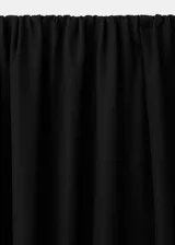 Pantalón negro de diseño balloon con tiro medio, cintura elástica y bajo con goma ajustable.