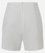 Short pollera corto color marrón de bengalina, con diseño cruzado en el frente, cierre invisible en la parte trasera y talle alto.