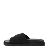 Sandalias planas Miss Carol Sage de estilo slide, color negro, con una tira ancha en el empeine decorada con una gran hebilla metálica plateada de estilo Western con grabados en relieve. Suela con ligera plataforma y base estriada.
