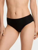 Panty tipo bikini de tiro medio, color negro, confeccionada en microfibra supersuave con acabado liso sin costuras termoselladas y cobertura moderada en la espalda.