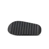 Sandalias Adidas Yeezy Slide color gris oscuro, de una sola pieza, con suela texturizada y diseño minimalista.