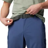 Pantalón convertible de senderismo color azul, diseñado con tecnología de secado rápido y protección solar. Cuenta con bolsillos cargo laterales, bolsillos de seguridad con cremallera y perneras desmontables mediante cremallera que permiten convertir la prenda en un pantalón corto.