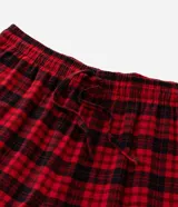 Pantalón de pijama de franela con estampado de cuadros en tonos rojos y negros, cuenta con cintura elástica y cordón de ajuste.