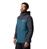 Campera 3 en 1 Columbia con sistema Interchange, compuesta por una capa exterior impermeable y transpirable con tecnología Omni-Tech y una capa interior aislante con forro termorreflectante Omni-Heat. Presenta diseño bicolor en azul y gris oscuro, capucha ajustable, ventilación en axilas, faldón para nieve y múltiples bolsillos con cierre.