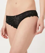 Bombacha de bikini color beige con encaje floral y moño decorativo.