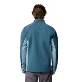 Campera polar de hombre con cierre frontal completo, cuello alto y tecnología Omni-Heat Arctic para aislamiento térmico. Presenta paneles laterales en un tono de azul más claro, mangas largas con orificios para los pulgares en los puños y bolsillos laterales con cierre.