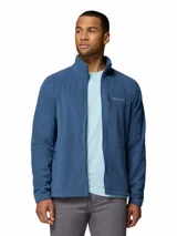 Campera polar de la marca Columbia, modelo Fast Trek II. Presenta cuello alto, cierre frontal completo, bolsillos laterales con cierre y un bolsillo adicional con cierre en el pecho, donde se encuentra el logo de la marca bordado.