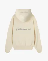 Campera con cierre frontal de Nude Project, confeccionada en algodón de alto gramaje con diseño oversized. Presenta capucha, bolsillos tipo canguro y un parche bordado con las iniciales NP en el pecho.