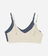 Kit de dos tops bralette confeccionados en poliamida sin costuras, con escote en V, tirantes finos regulables y copas removibles.