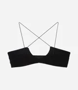 Soutien tipo bralette confeccionado en tule, con diseño de escote profundo, breteles finos y sin copa. Presenta un recorte central y una estructura ligera que se ajusta al cuerpo.