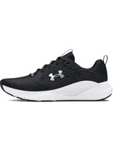 Championes deportivos Under Armour modelo Charged Commit TR 4, color negro con entresuela blanca y logo de la marca en el lateral.