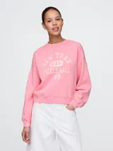 Buzo deportivo rojo de corte holgado y cuello redondo.